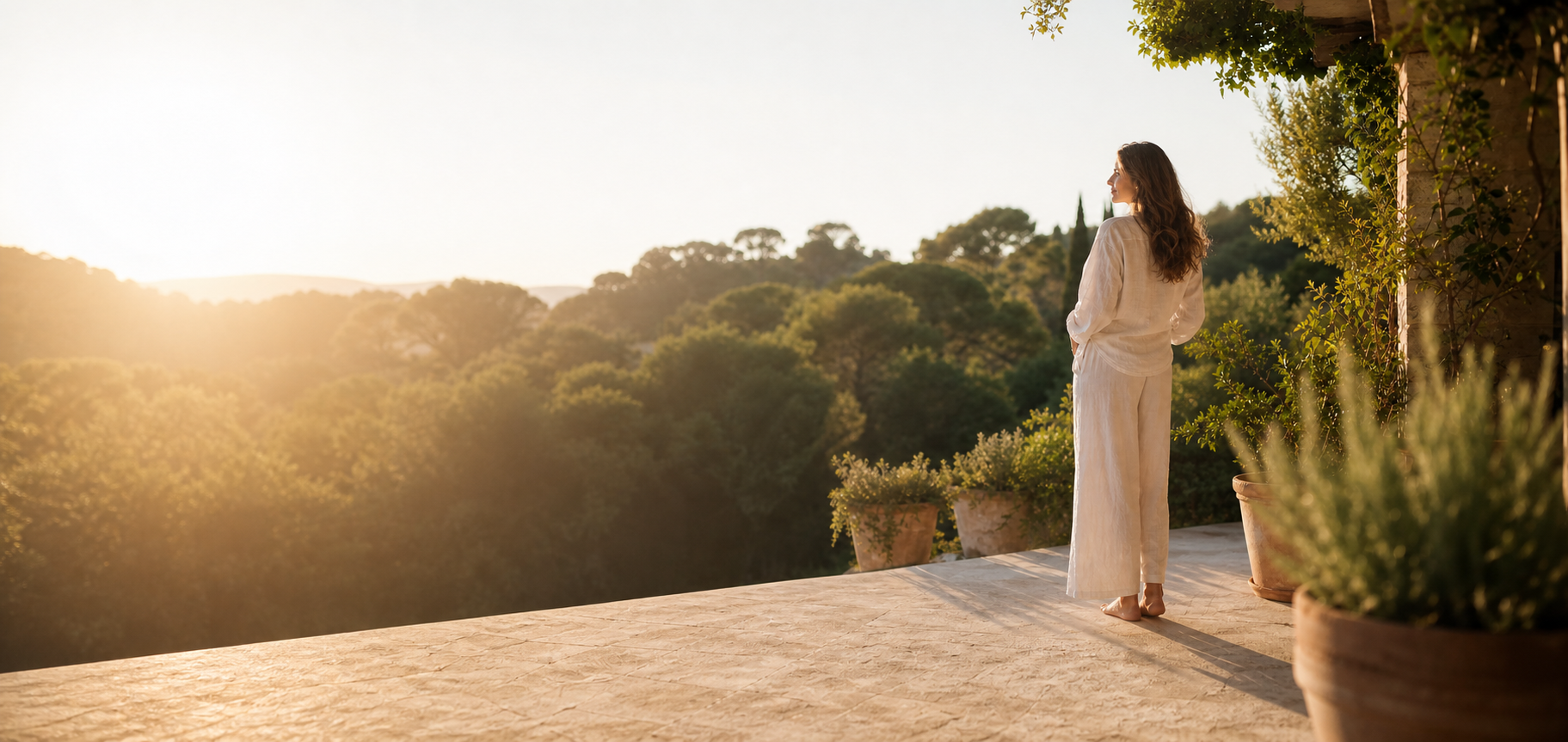 Vinatzen Liver Support — woman relaxing on a sunlit outdoor terrace surrounded by lush greenery, warm golden morning light, natural herbal wellness lifestyle